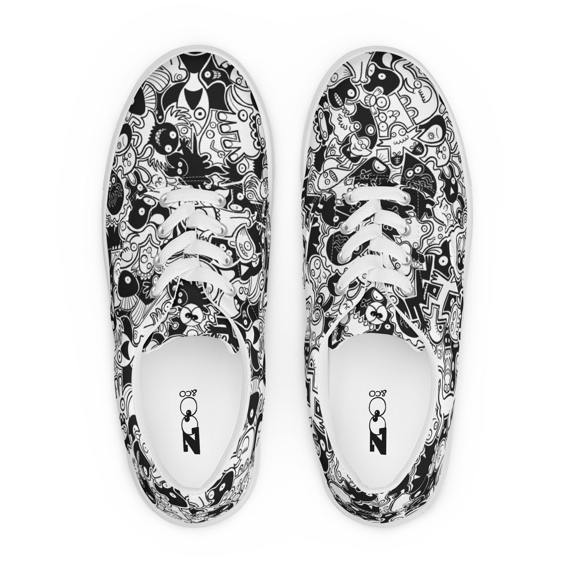 Joyful crowd of black and white doodle creatures Women’s lace-up canvas shoes. Top view