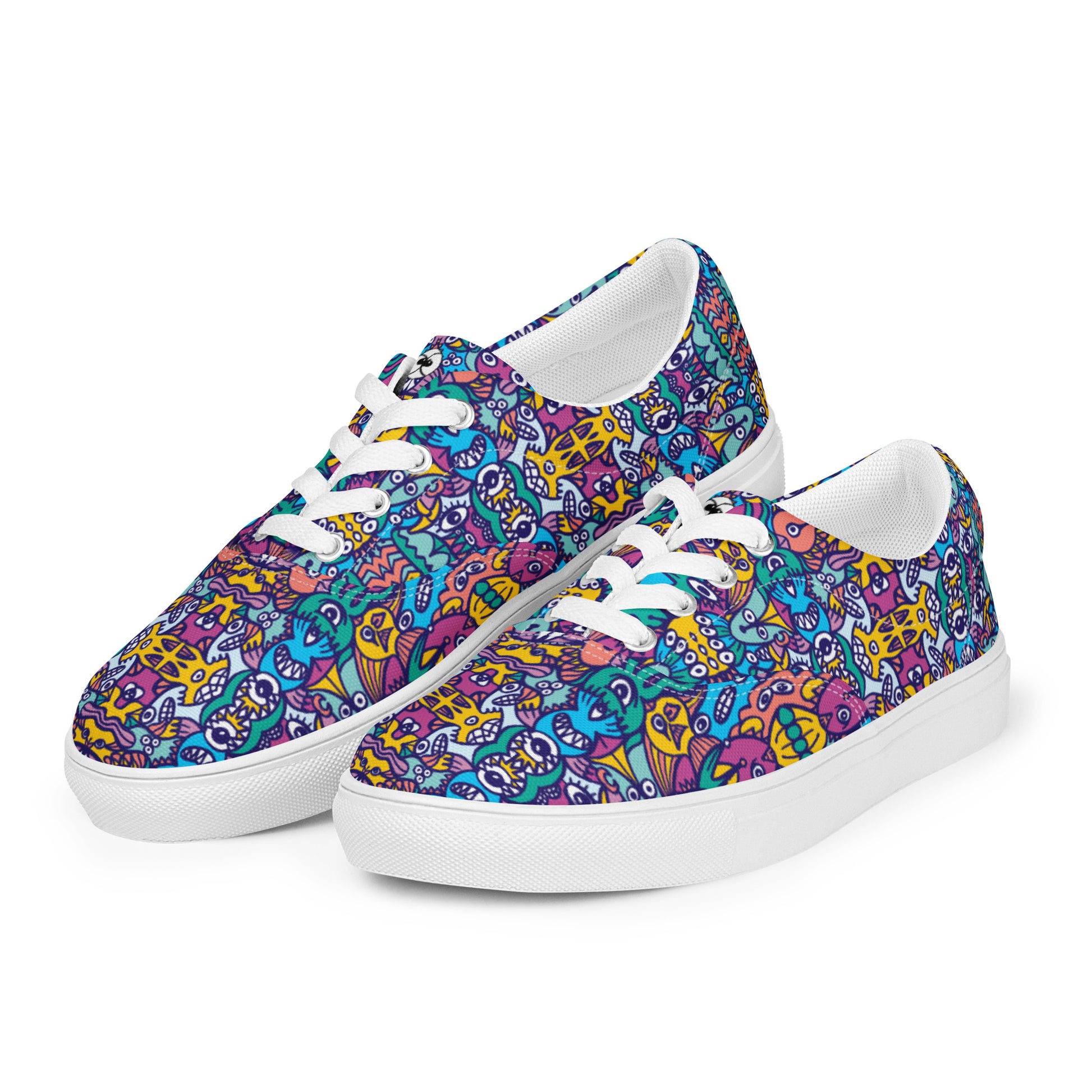 Whimsical design featuring multicolor critters from another world Women’s lace-up canvas shoes. Playing with shoes
