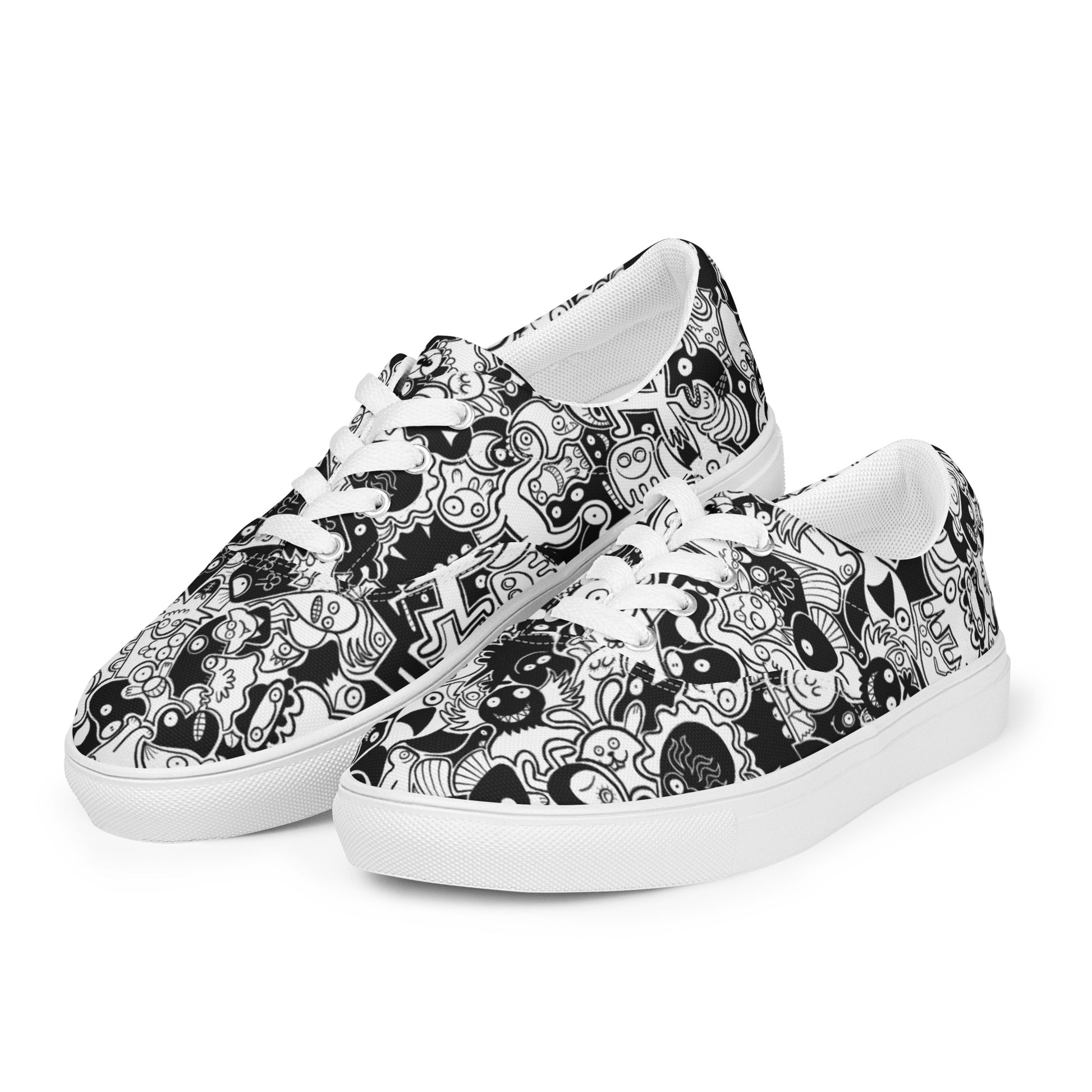 Joyful crowd of black and white doodle creatures Women’s lace-up canvas shoes. Playing with shoes