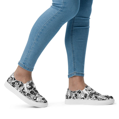 Joyful crowd of black and white doodle creatures Women’s slip-on canvas shoes. Lifestyle